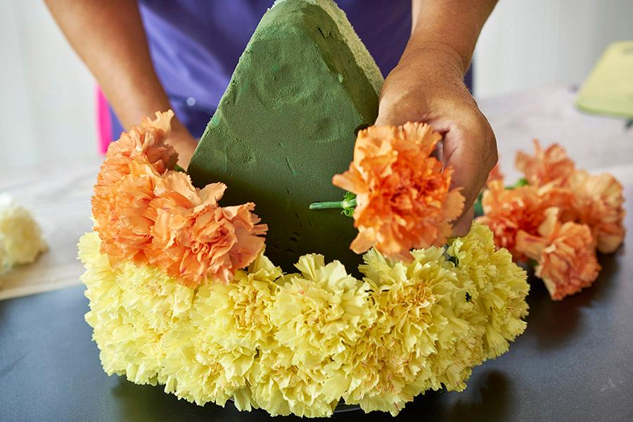 candy corn decorations two rows of orange carnations
