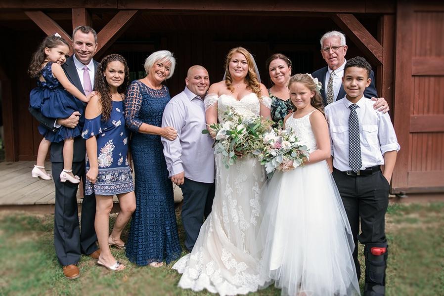 Family standing together on wedding day